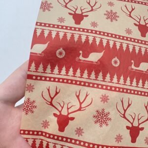 Red Christmas tissue paper with reindeer head design, ideal for seasonal gift wrapping and boutique packaging.