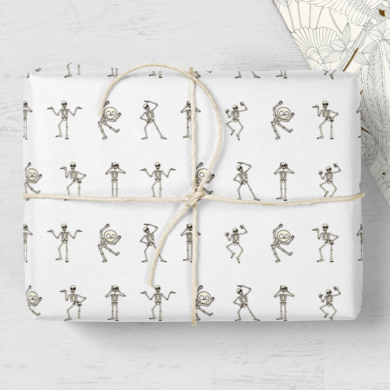 Tissue paper with dancing skeleton design, perfect for gift wrapping and seasonal packaging