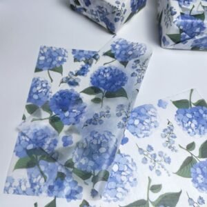 White tissue paper with blue hydrangea floral print, ideal for elegant gift wrapping and retail packaging.